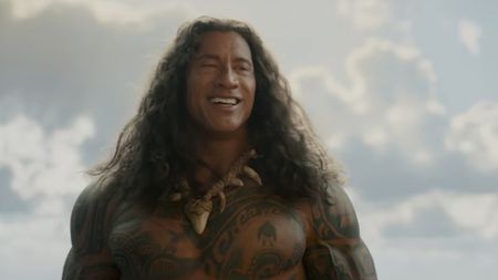 Maui smiling in the Moana trailer.