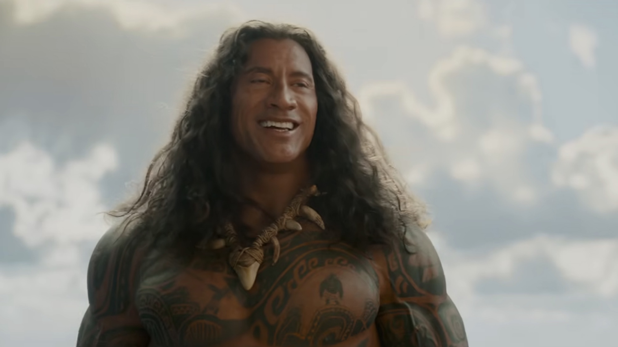 Maui smiling in the Moana trailer.