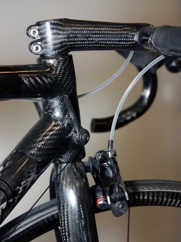 About the only things in this image that aren't carbon fiber are the cables, housing, tires, stem bolts, and brake pads.