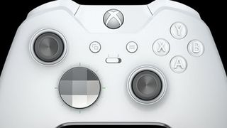 A close up of the previous white elite Xbox controller