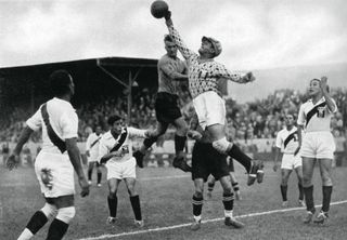 Peru's Olympic football team in action, Berlin Olympics, 1936. Peru were involved in an astonishing controversy at the Berlin Olympic football tournament. After they beat Austria, the eventual silver medallists, after extra time in the quarter-finals, the Austrians protested that they had been assaulted by Peruvian players and the pitch had been invaded by a specator with a revolver. FIFA ordered the match to be replayed and the Peruvians refused to do so, withdrawing their entire Olympic team in protest. Back in Peru there were riots with the German consulate stoned by protesters. A print from Olympia 1936, Die Olympischen Spiele 1936, Volume II, Cigaretten-Bilderdienst, Hamburg, 1936. (Photo by The Print Collector/Print Collector/Getty Images)