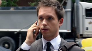 Patrick J Adams as Mike talking on the phone in Suits