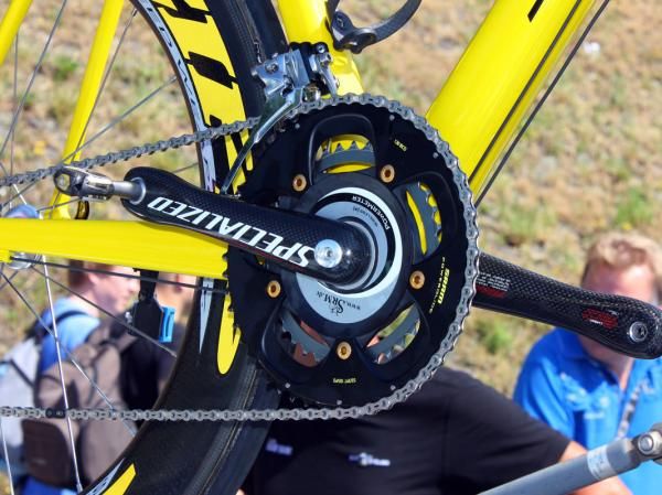 Check out the SRAM Red LTE group's yellow accents and the gold chainring bolts (and pedal end caps!) on Fabian Cancellara's Specialized S-Works Tarmac SL3.