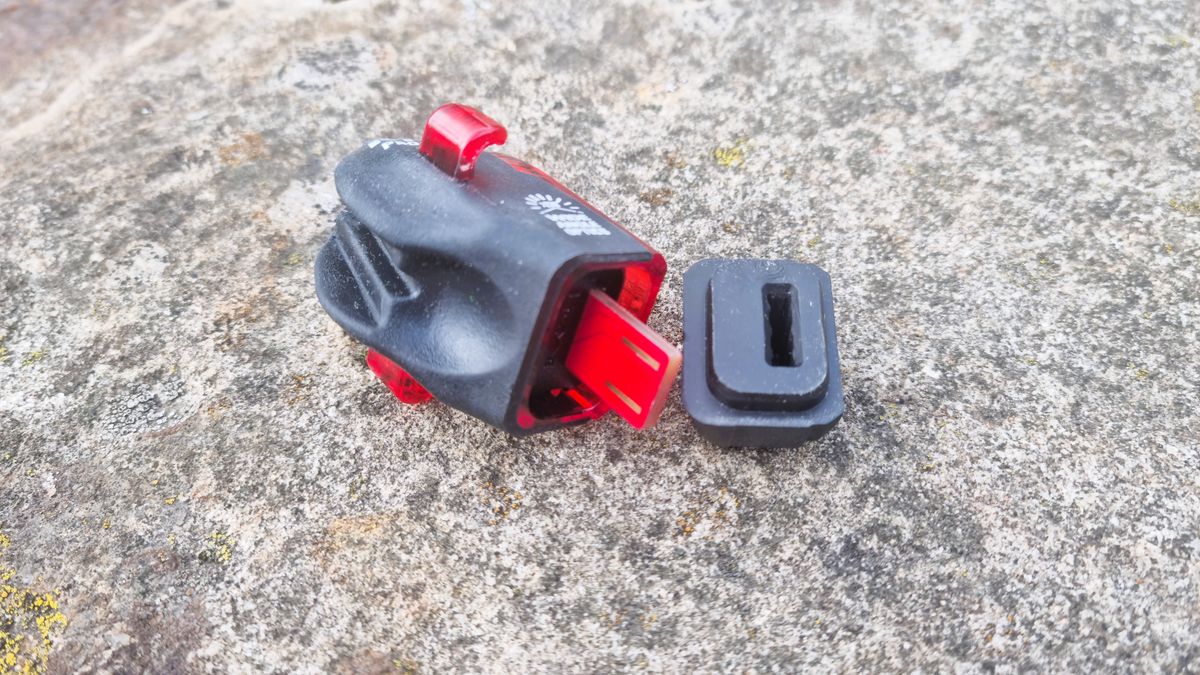 The Lezyne KTV Drive Pro+ dismantled, showing the USB charging bung