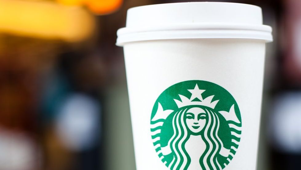 Grande Starbucks to go cup on table