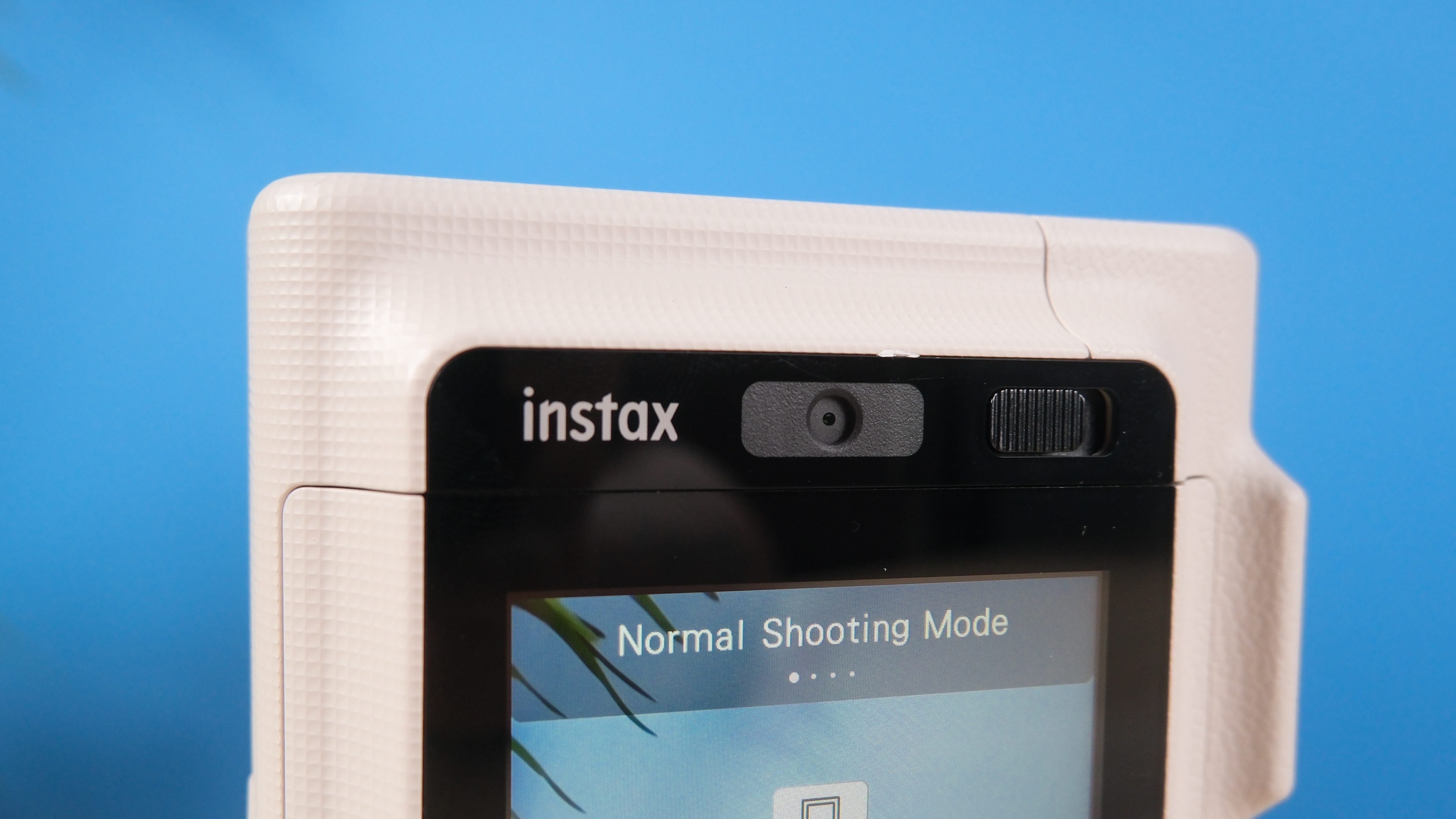 A Sand Beige Fujifilm Instax mini LiPlay Plus hybrid instant camera