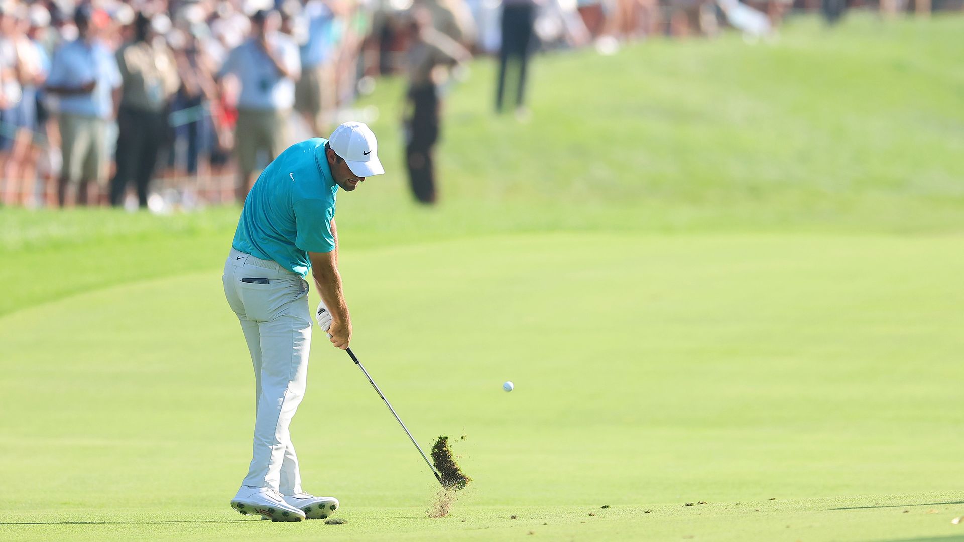 Scottie Scheffler of the United States plays a shot on the 18th hole during the final round of the BMW Championship at Olympia Fields Country Club on August 20, 2023