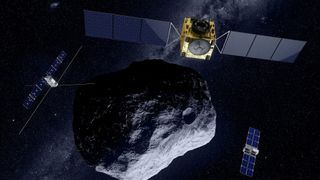 three small satellites in space around an asteroid