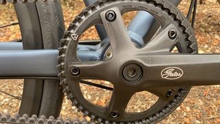 A close-up shot of the Gates CDN S150 50-tooth chainset for use with Gates belt drive system mounted on a Boardman URB 8.9 hybrid