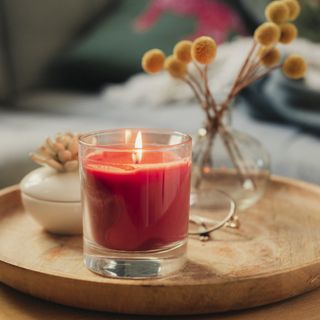 scented candle on tray