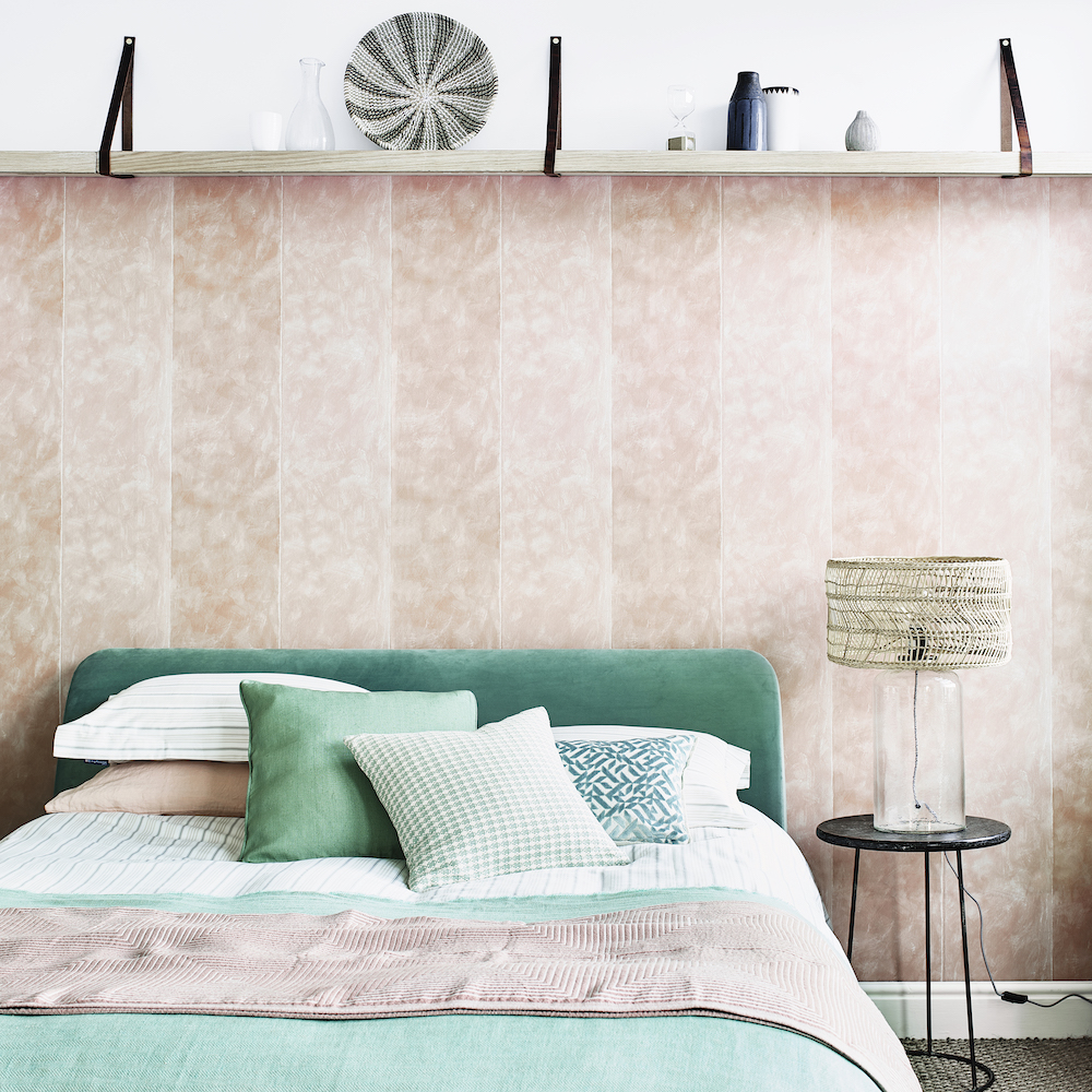 bedroom with bed with green bedding