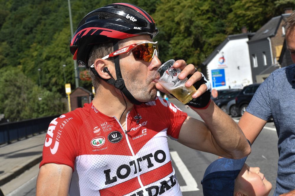 Lotto Soudal's Maxime Monfort enjoys a beverage after stage 3 at the Tour de Wallonie