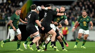 The Springboks' RG Snyman offloads the ball during a match between New Zealand and South Africa in 2025