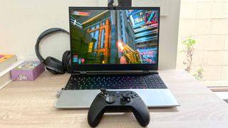 Framework Laptop 16 review unit on desk playing Cyberpunk 2077