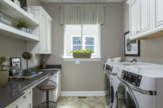 Organized Laundry Room with storage cupboards