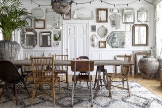 dining room with vintage mirror gallery wall