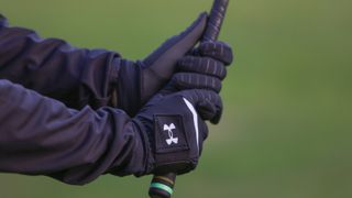 Close up on a pair of winter golf gloves