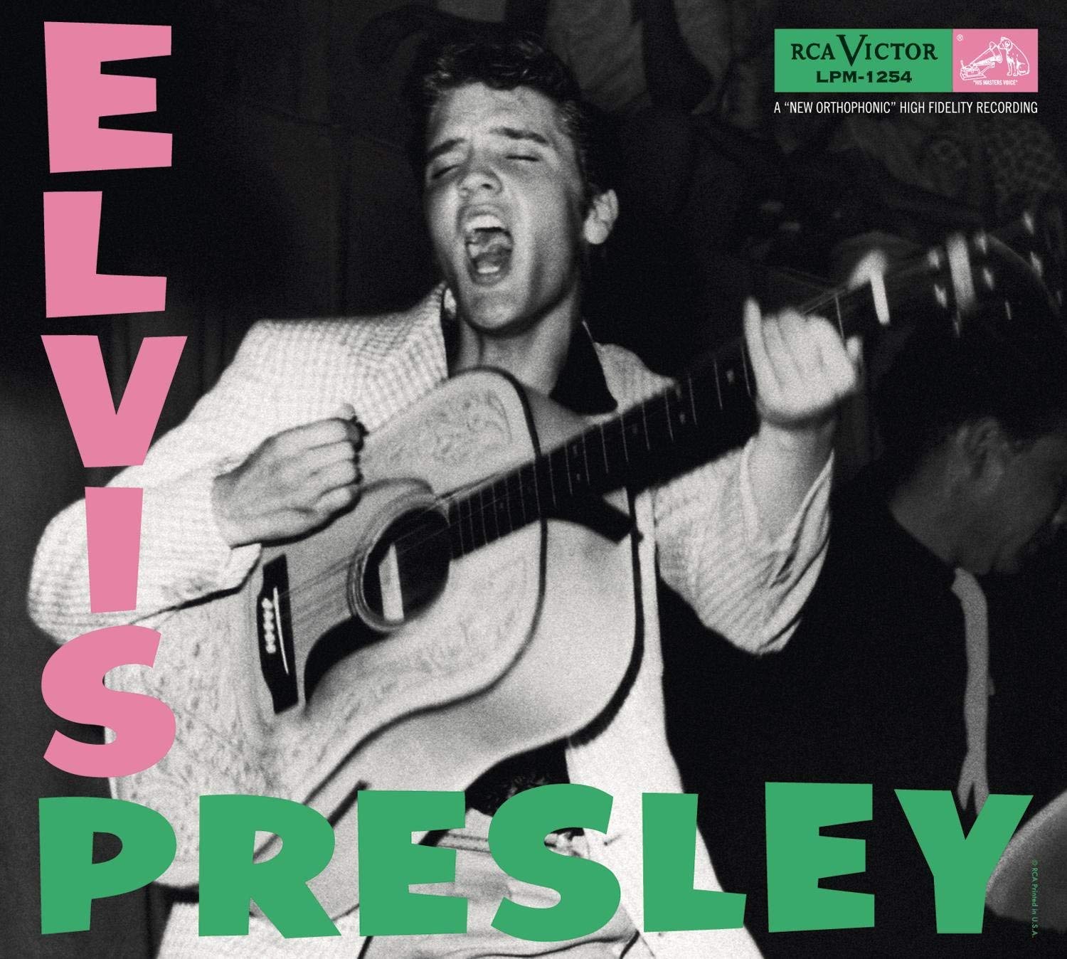 Album cover showing Elvis playing guitar and singing