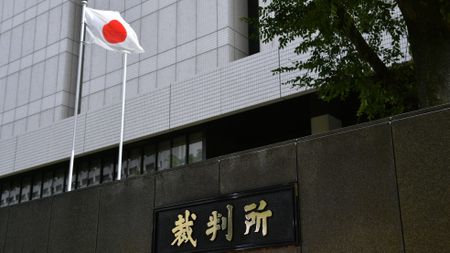 A Japanese national flag flies outside the Tokyo District Court in Tokyo, Japan, on Tuesday, Sept. 15, 2020. 