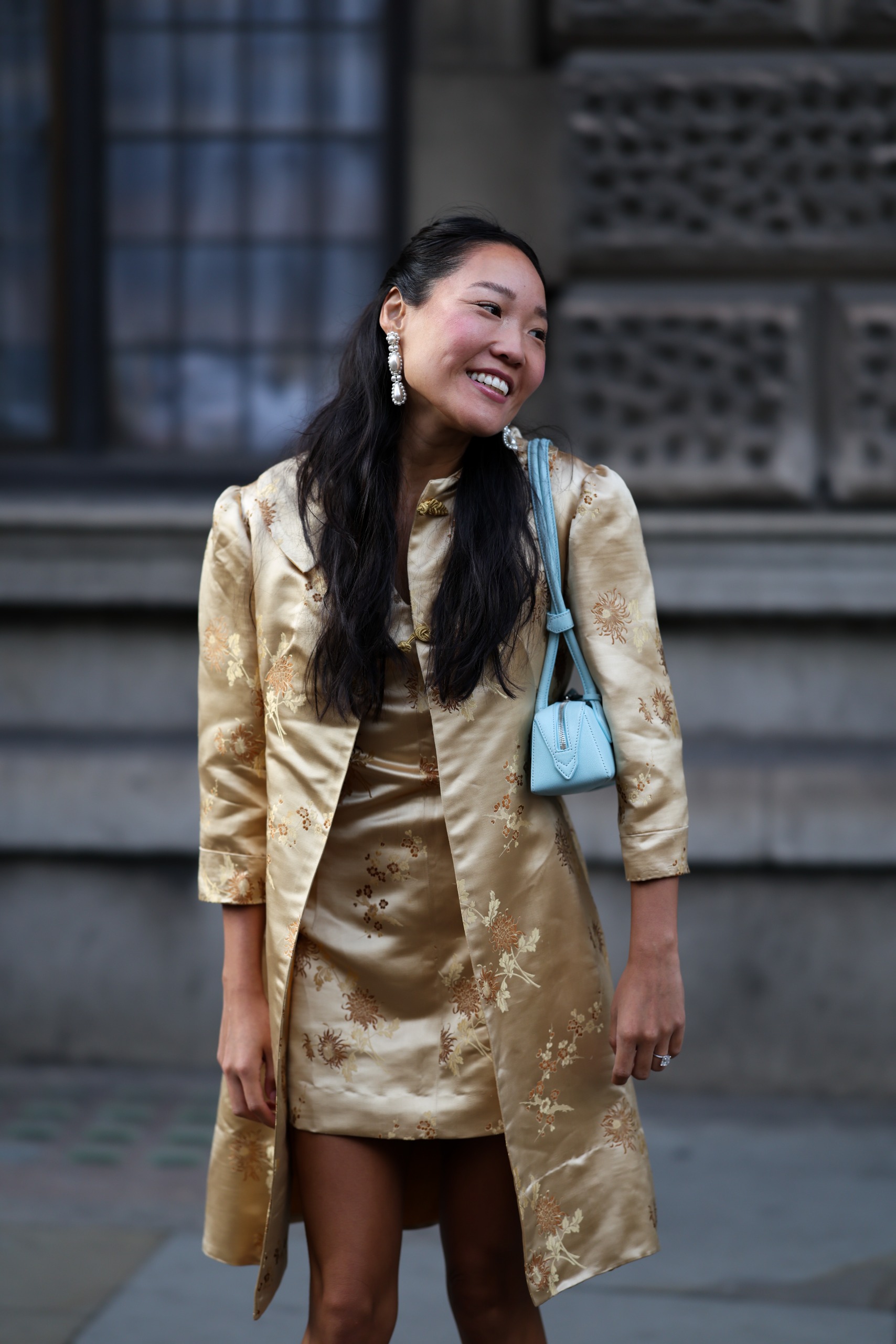 woman wearing brocade jacket and skirt