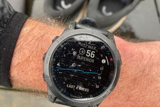 The Garmin Epix 2 smartwatch being worn by the reviewer, with the VO2 max data screen showing