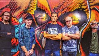 Stuckfish band shot from 2022 in front of colourful graffiti