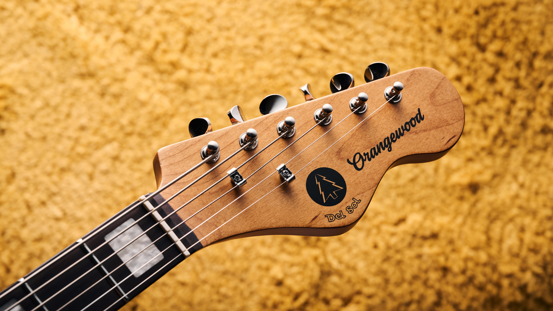 The headstock of the Orangewood Del Sol Baritone guitar