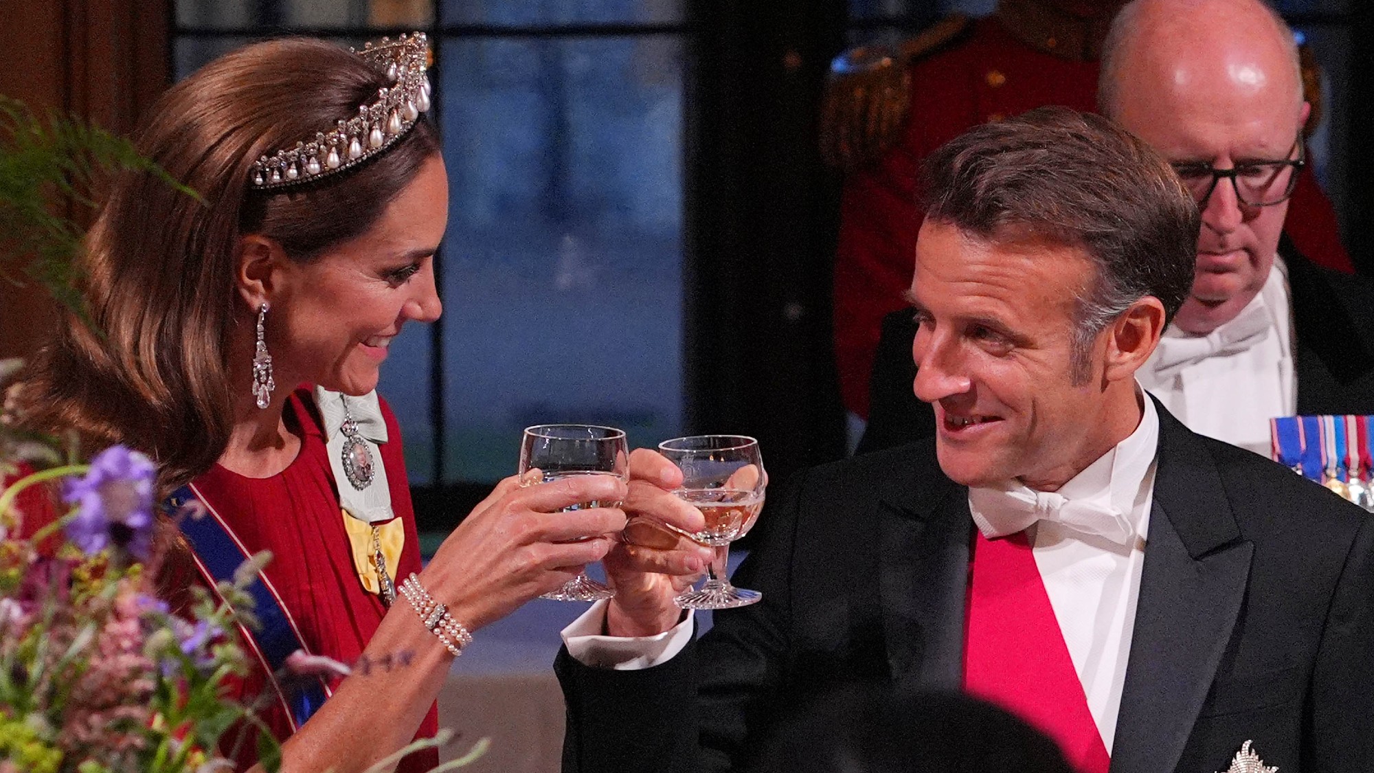 Emmanuel Macron clinks glasses with Catherine, Princess of Wales during a State Banquet in his honour