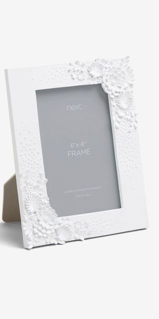 White photo frame with flower details