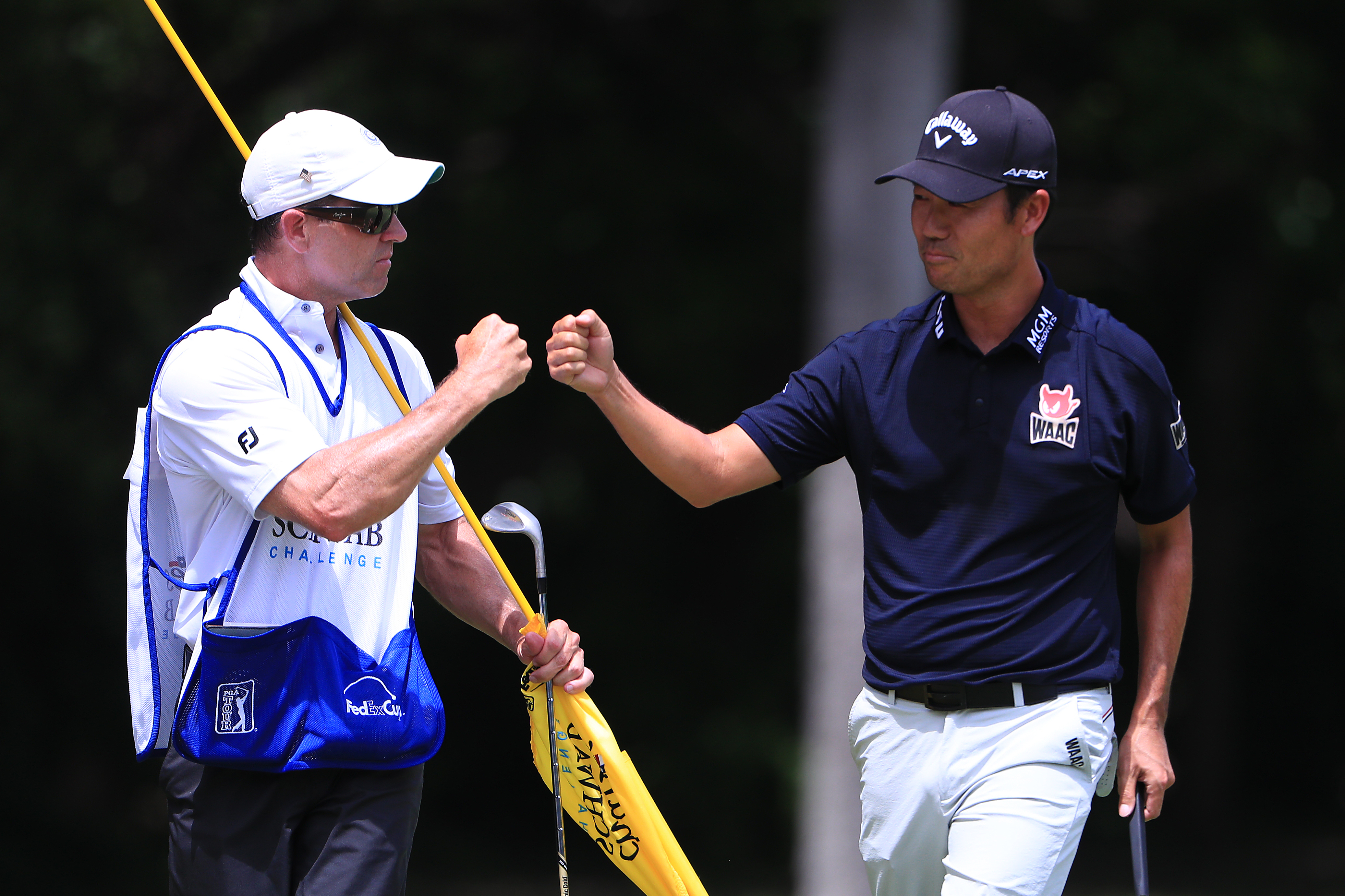 Kenny Harms and Kevin Na fist bump at the Charles Schwab Challenge