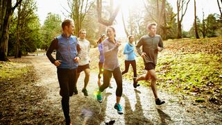 Group of people running outdoors together