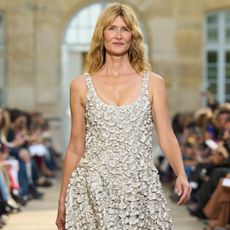 Laura Dern started the Gabriela Hearst Paris Fashion Week show in a white dress and sandals