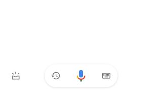 The microphone icon at the bottom of the Google Assistant screen on iPhone