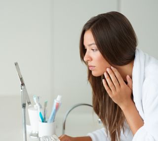 face in mirror, woman, skin, looking at skin