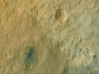 NASA's Mars Reconnaissance Orbiter snapped this color photo of the Curiosity rover from space.