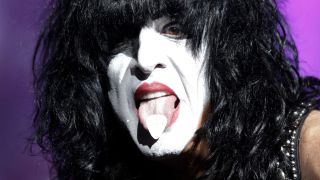 Paul Stanley onstage with his tongue poking out