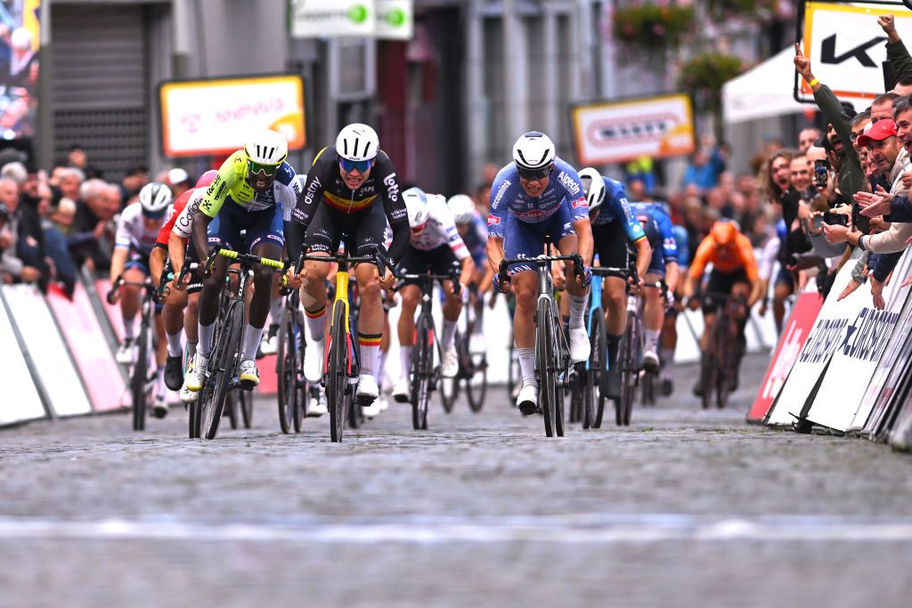 BINCHE BELGIUM OCTOBER 01 EDITORS NOTE Alternate crop LR Biniam Girmay of Eritrea and Team Intermarche Wanty race winner Arnaud de Lie of Belgium and Team Lotto Dstny and Jasper Philipsen of Belgium and Team Alpecin Deceuninck sprint at finish line during the 37th Binche Chimay Binche Memorial Frank Vandenbroucke 2024 a 1986km one day race from Binche to Binche on October 01 2024 in Binche Belgium Photo by Luc ClaessenGetty Images