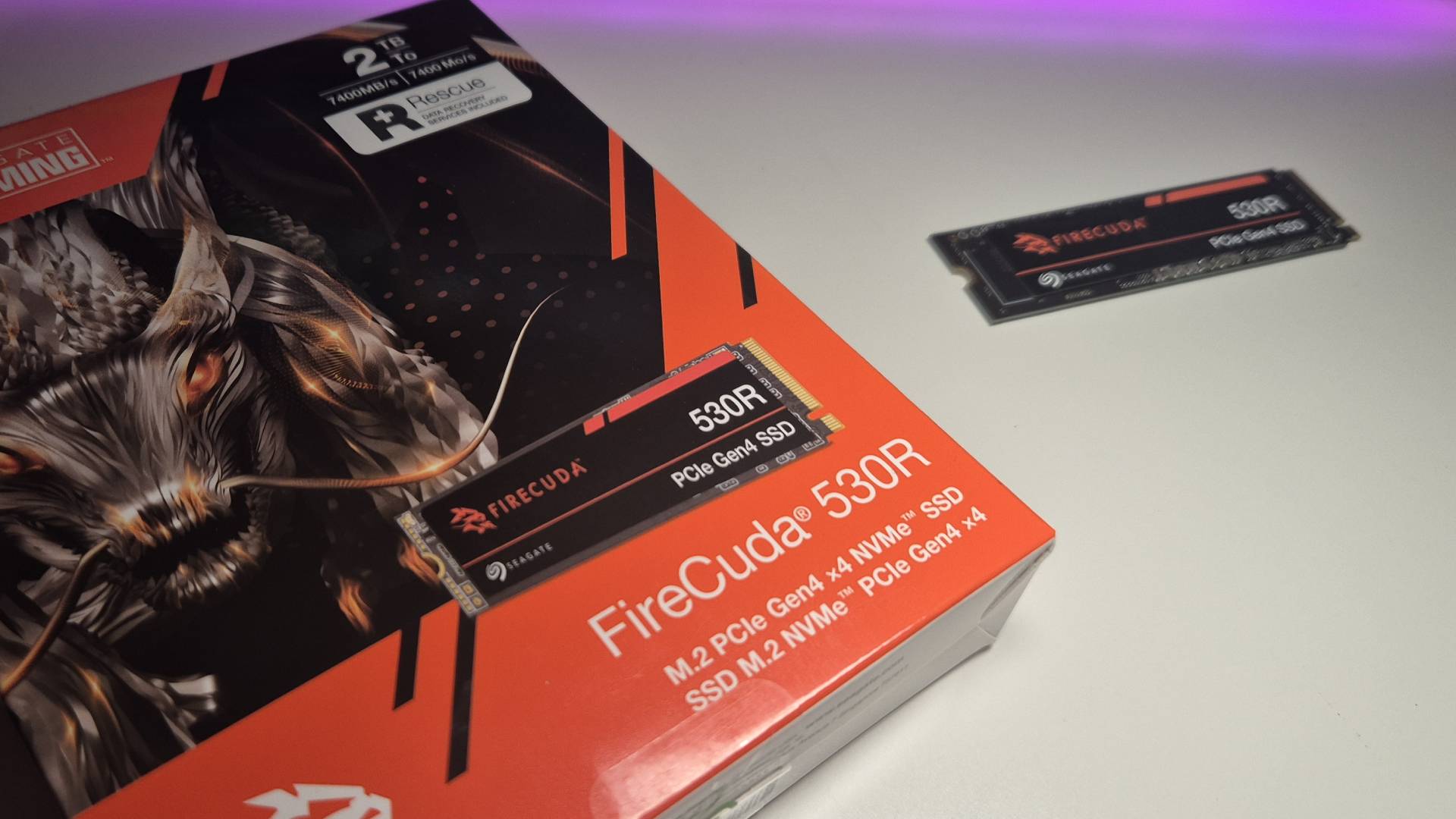 Image of the FireCuda 530R box sitting on a white desk with the SSD in the background.