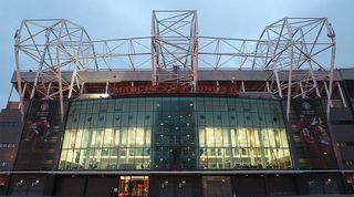 Old Trafford stadium at night