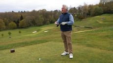 Adjusting a driver on the tee