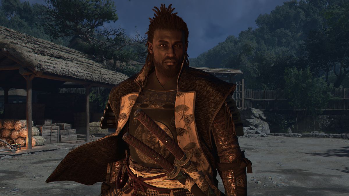 Assassin&#039;s Creed Shadows canon mode - An upper-body shot of Yasuke standing in the hideout.