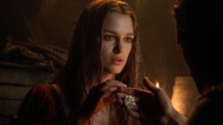 Keira Knightley holding the pendant in Pirates of the Caribbean