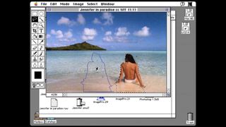 A woman sitting on a beach in an early version of Photoshop