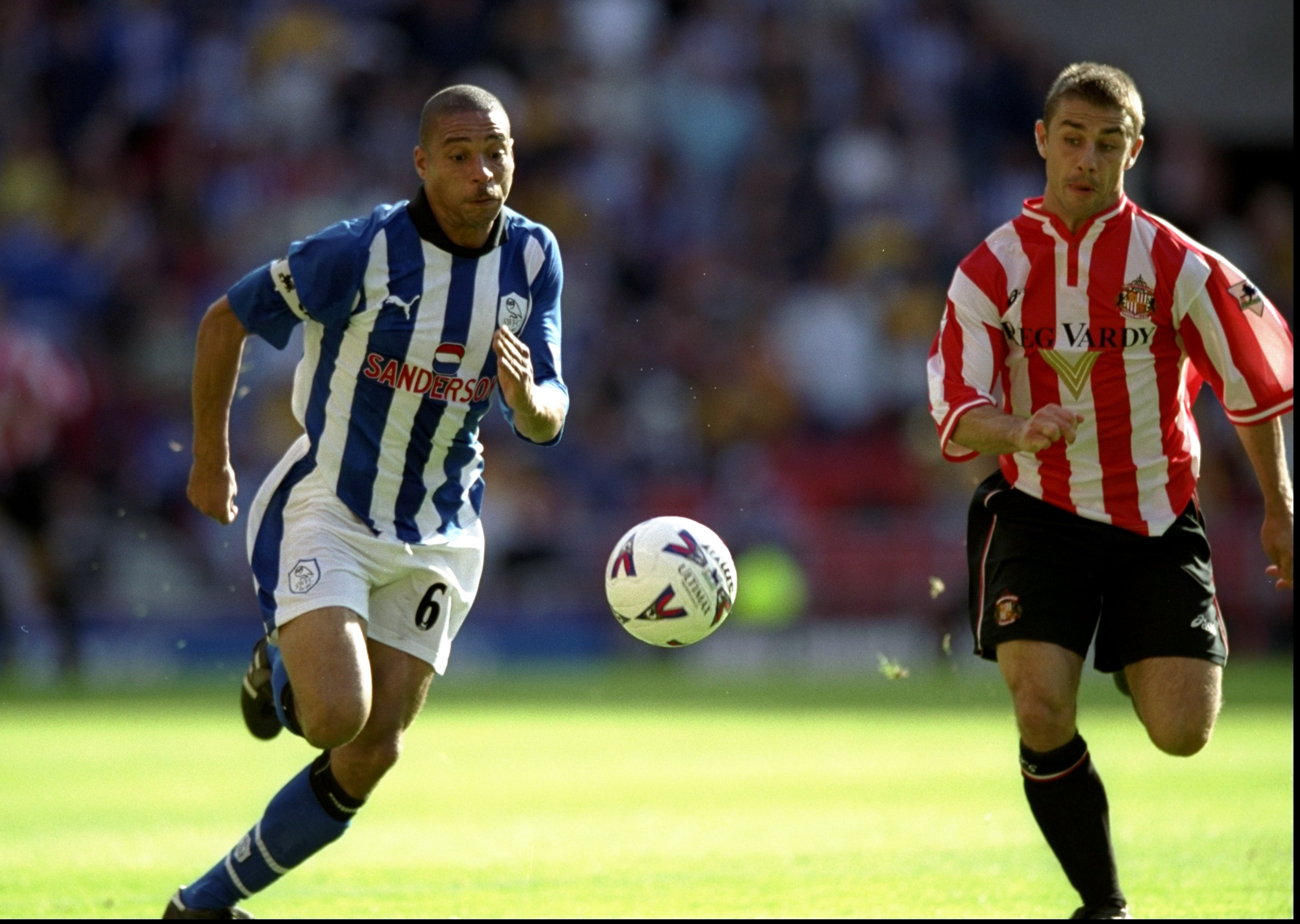 Sheffield Wednesday's Des Walker competes for the ball with Sunderland's Kevin Phillips in a Premier League match in September 1999.