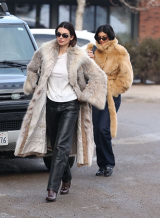 kendall and kylie jenner wearing matching fur coats in Aspen