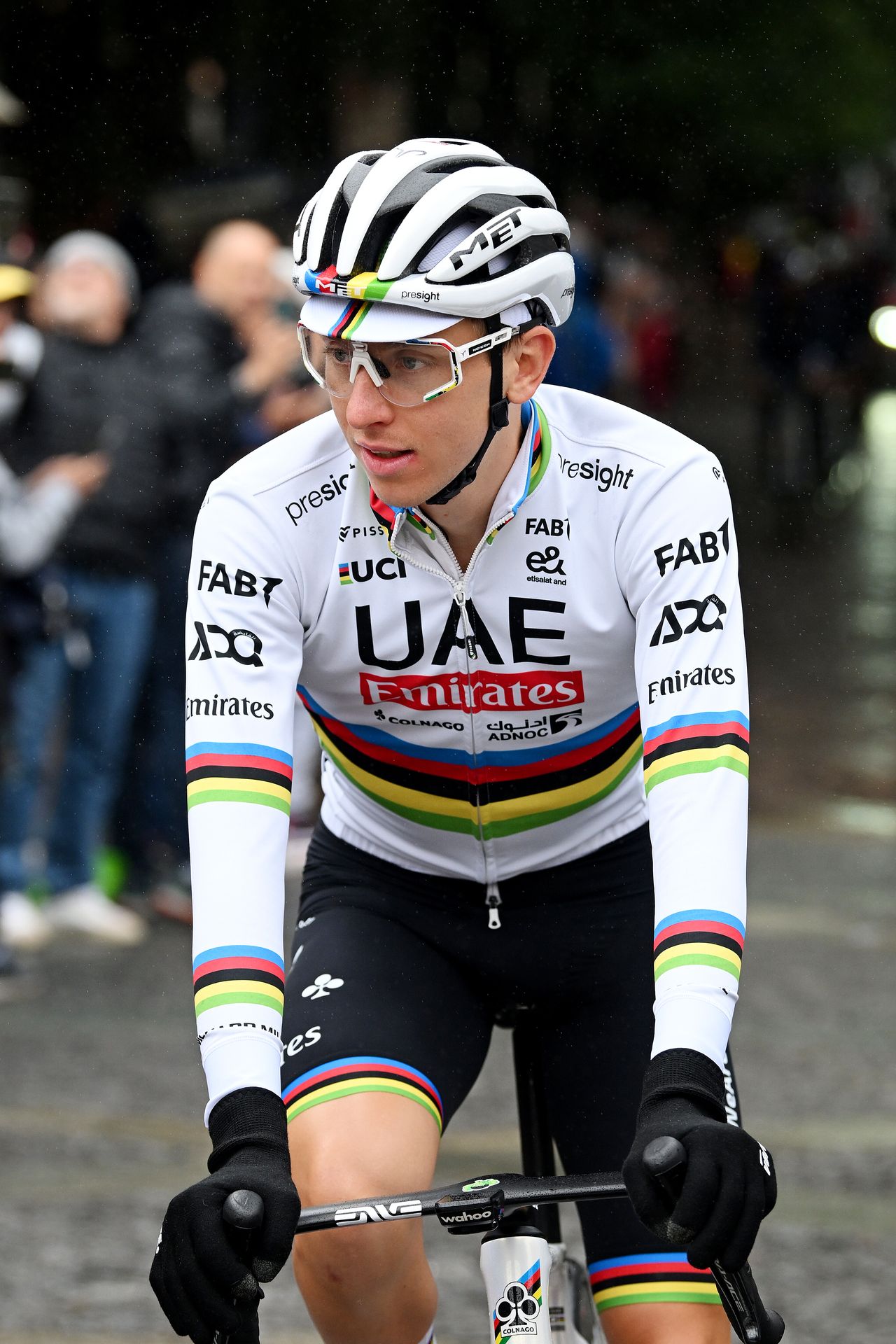 Tadej Pogacar racing in the rainbow jersey