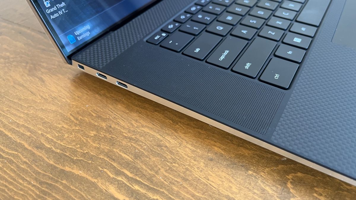 Dell XPS 17 laptop in use on a wooden desk