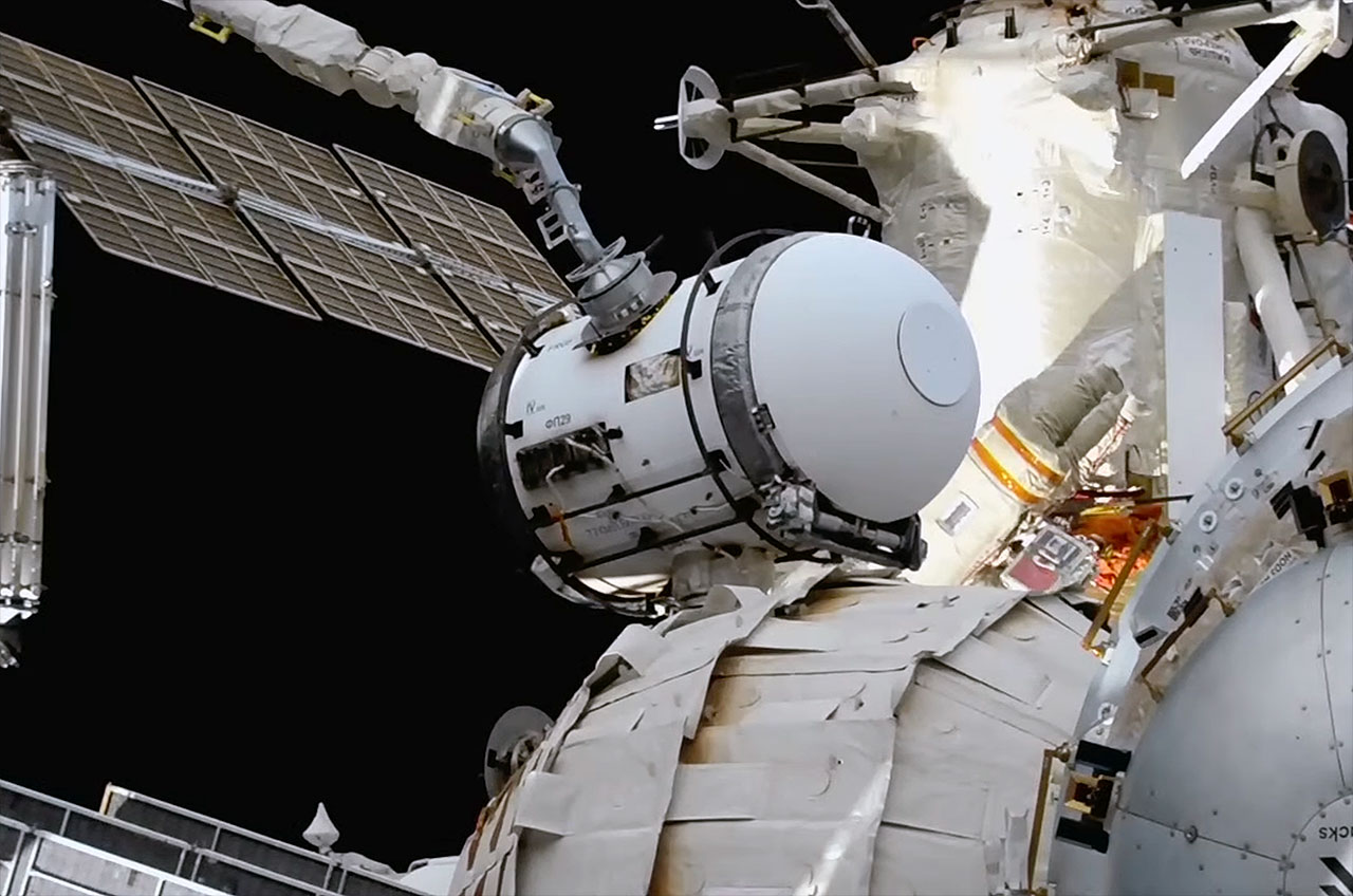 An experiment airlock that had been attached to the Rassvet mini-research module since its launch in 2010 is seen being moved by the European Robotic Arm to its new home on the Nauka multipurpose Laboratory module at the International Space Station on Wednesday, May 3, 2023.