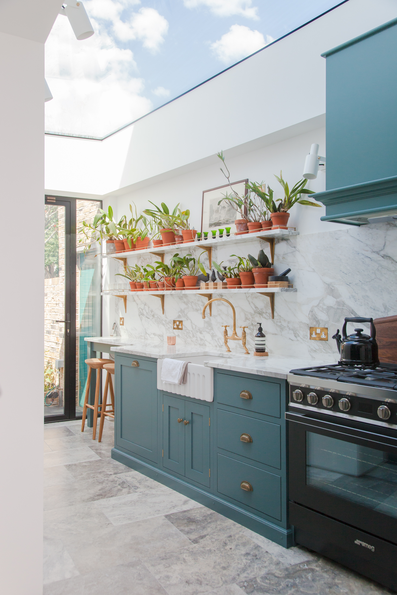 Kitchen with terracotta pots on shelves