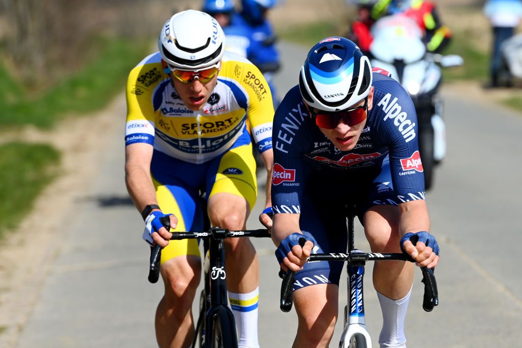 HARELBEKE BELGIUM MARCH 25 LR Sander De Pestel of Belgium and Team Sport Vlaanderen Baloise and Tobias Bayer of Austria and Team AlpecinFenix compete in the chase group during the 65th E3 Saxo Bank Classic 2022 a 2039km one day race from Harelbeke to Harelbeke E3SaxobankClassic WorldTour on March 25 2022 in Harelbeke Belgium Photo by Tim de WaeleGetty Images